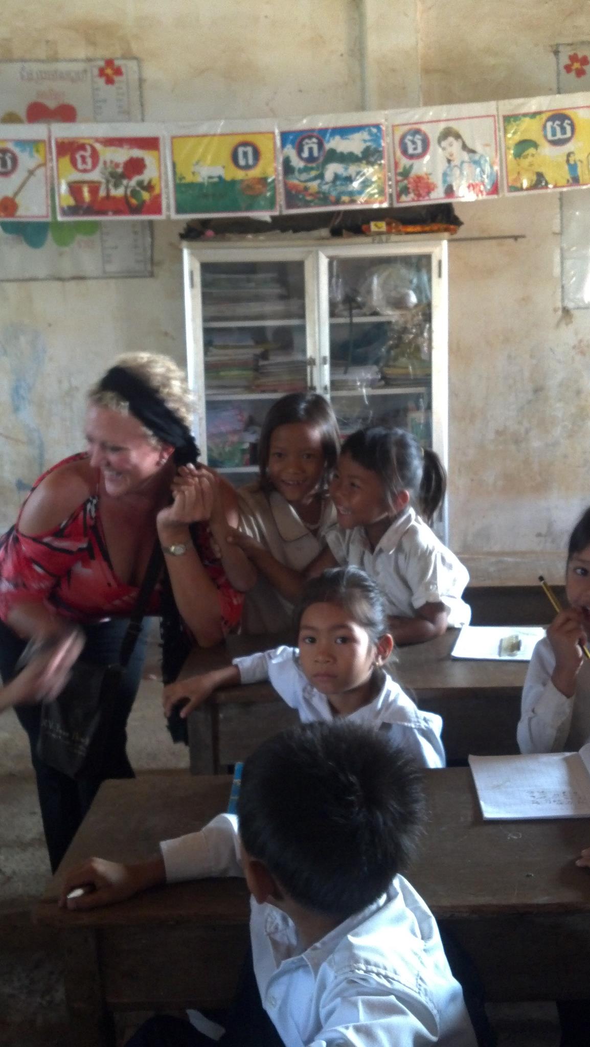 Dr. Kaye working with children overseas.