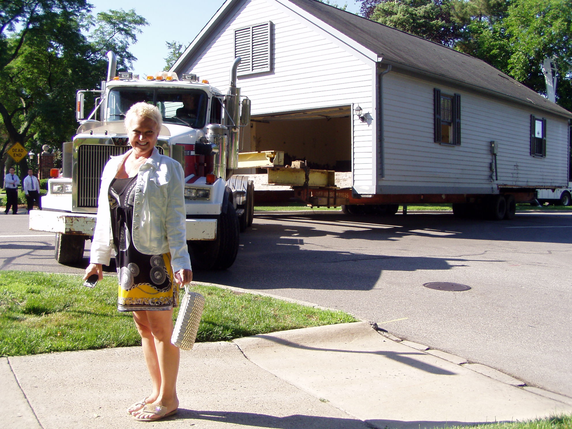 Dr. Leslie Kaye in front of the first part of the moving house.
