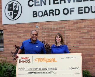 Keith Weaver, Lamb Weston representative, is pictured presenting a $50,000 check to Stephanie Zinger, foodservice director at Centerville City Schools in Ohio.