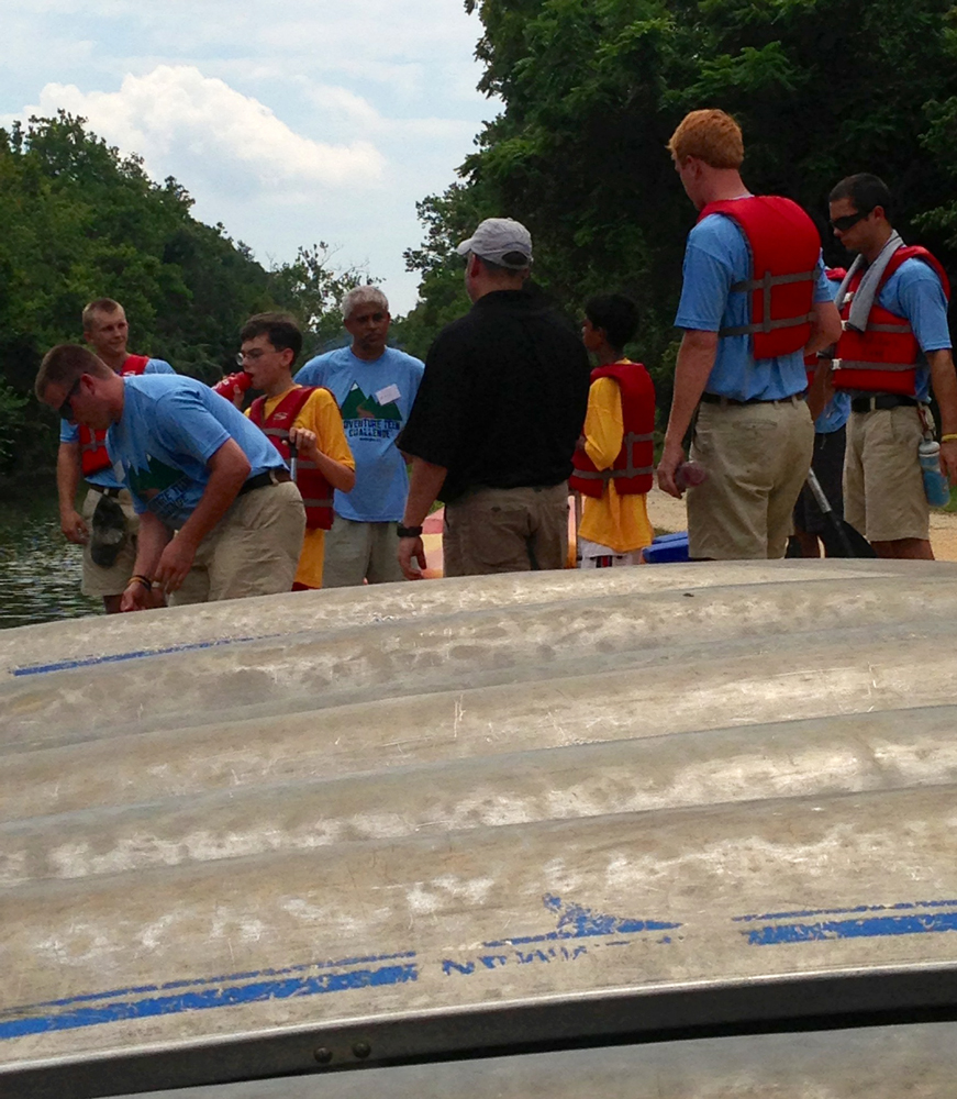 At the 2013 Adventure Team Challenge – Washington D.C., participants prepare a canoe for use in the canal. Photograph by Kimberly Warpinski.