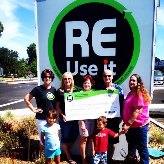 ReUseIt.org Presenting Fundraising Check to Nonprofit Partner