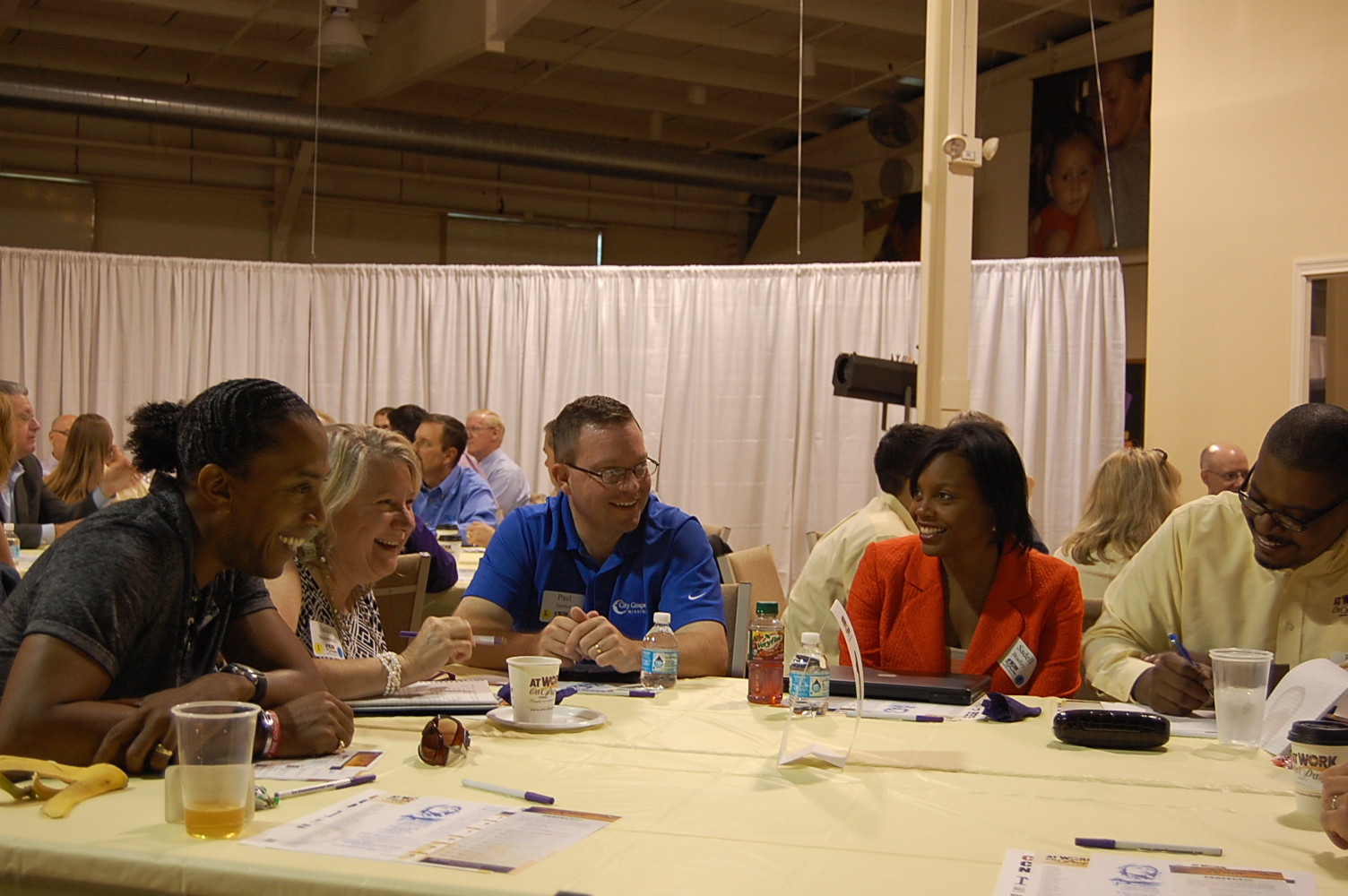 Participants engage in a roundtable discussion on expressing faith at work. (Memories Matter Photo)