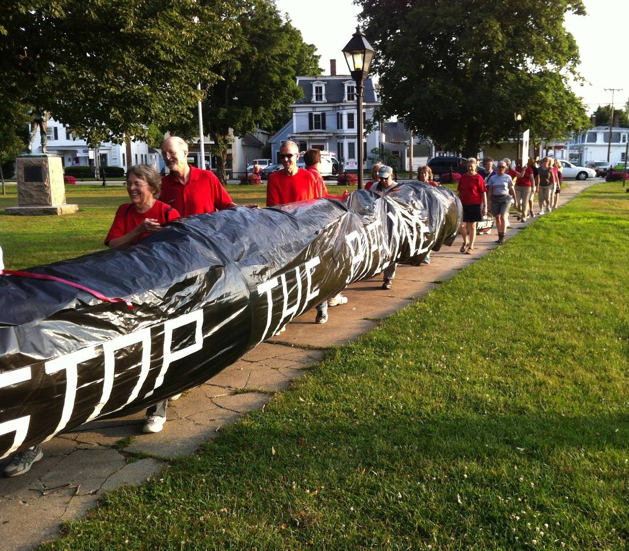 Kinder Morgan Tennessee Gas Pipeline “Rolling Rally” protesters with “The Pipe” arrives at Townsend Common, MA, July 21. The rally will end on the steps of the MA State House on July 30, 2014.
