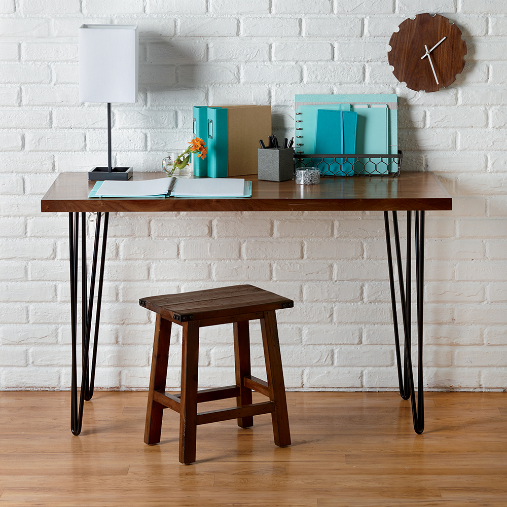 The legs retain a simple, airy hairpin leg design that has been a staple of mid-century modern furniture for decades.