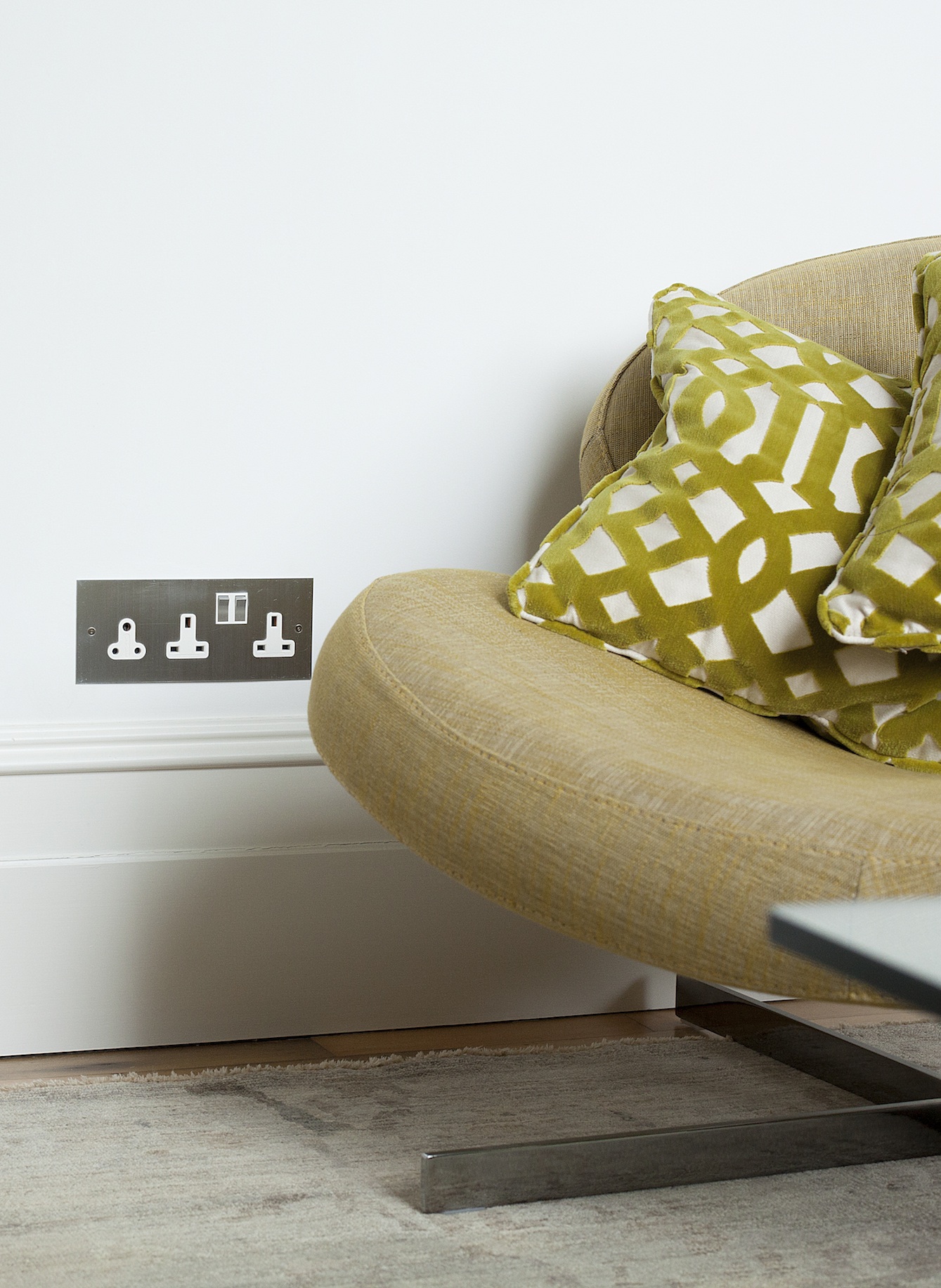 Bespoke switch plate specified by designer Audrey Lovelock for Lansdowne House. The plate design features two double sockets plus 5 amp lamp socket.