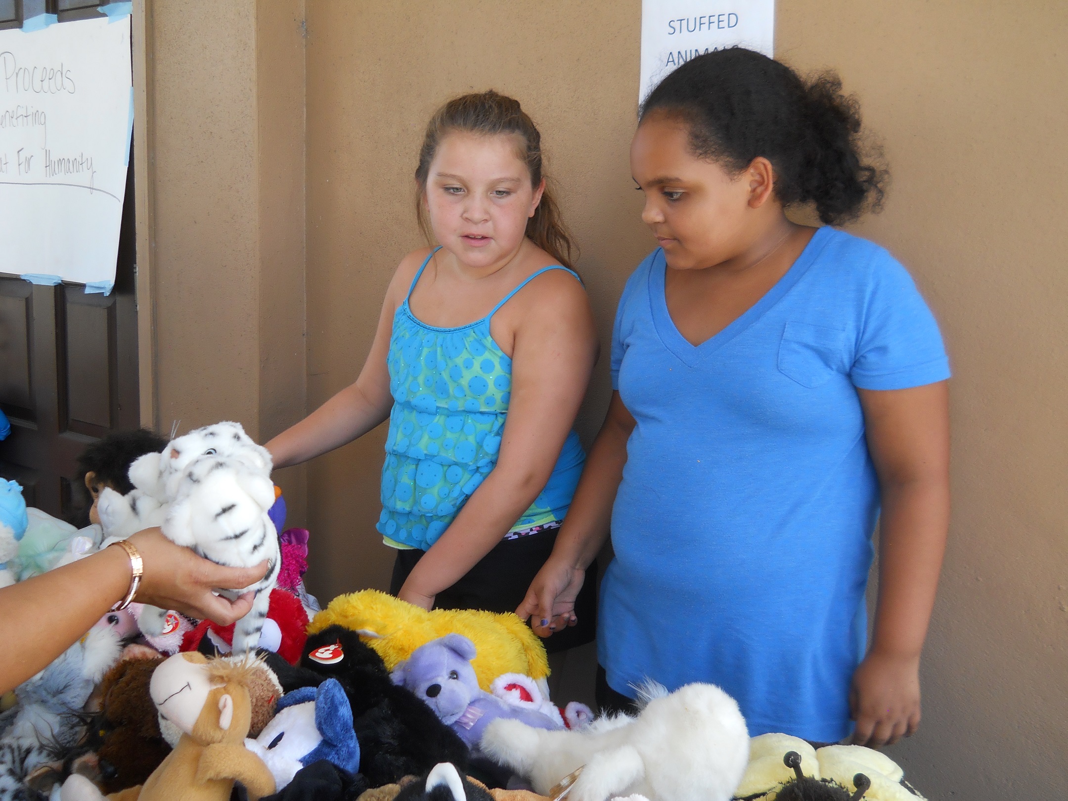 Rich Dad Education employees’ children and grandchildren did their part to make the charity yard sale a success