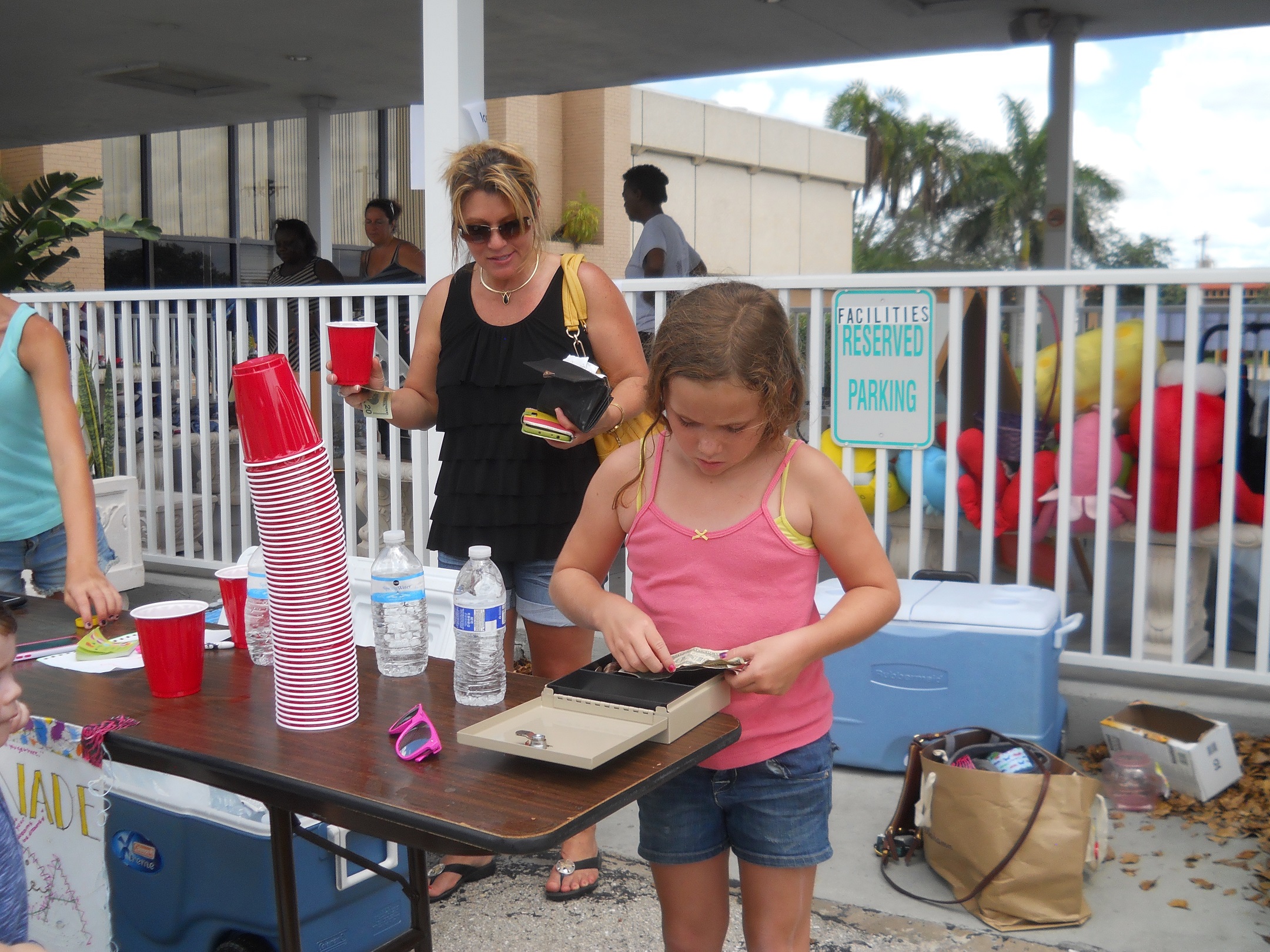 Rich Dad Education employees’ children and grandchildren did their part to make the charity yard sale a success