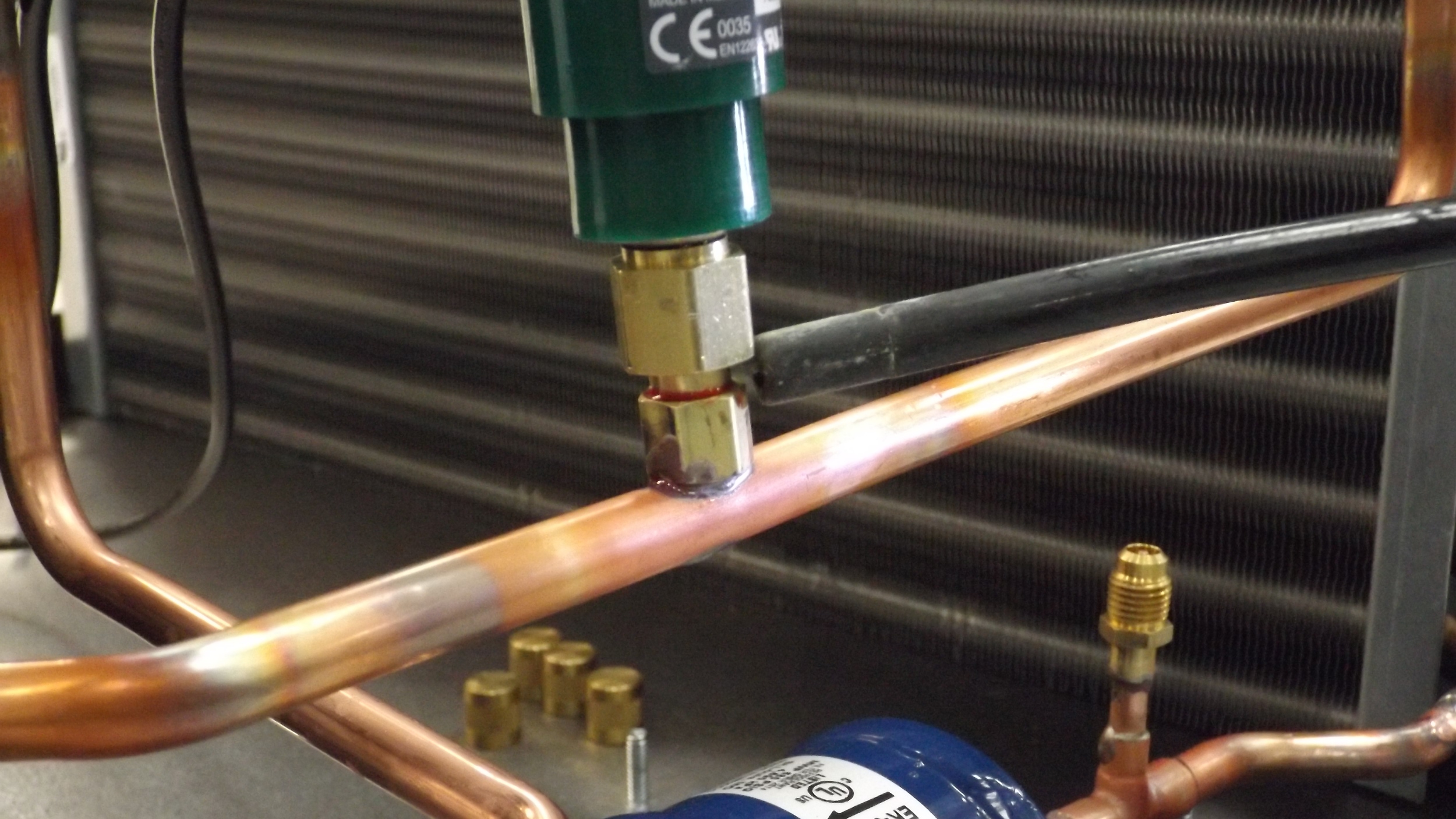 A helium leak detector is used to check all brazing locations on every Wine Guardian TTW cooling system.The detector has improved first-pass yield to 100% in recent months.