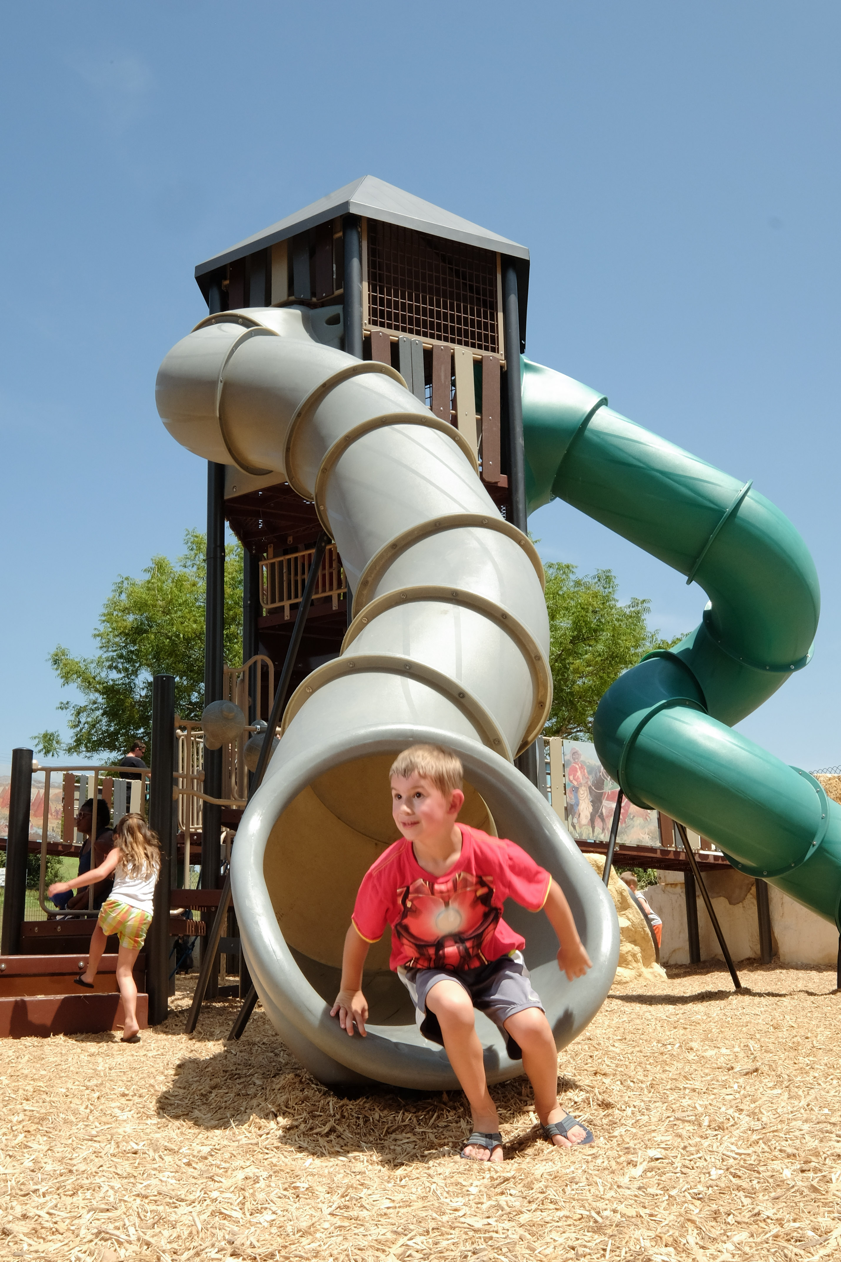 At the center of the playground is a massive tower with tube slides!