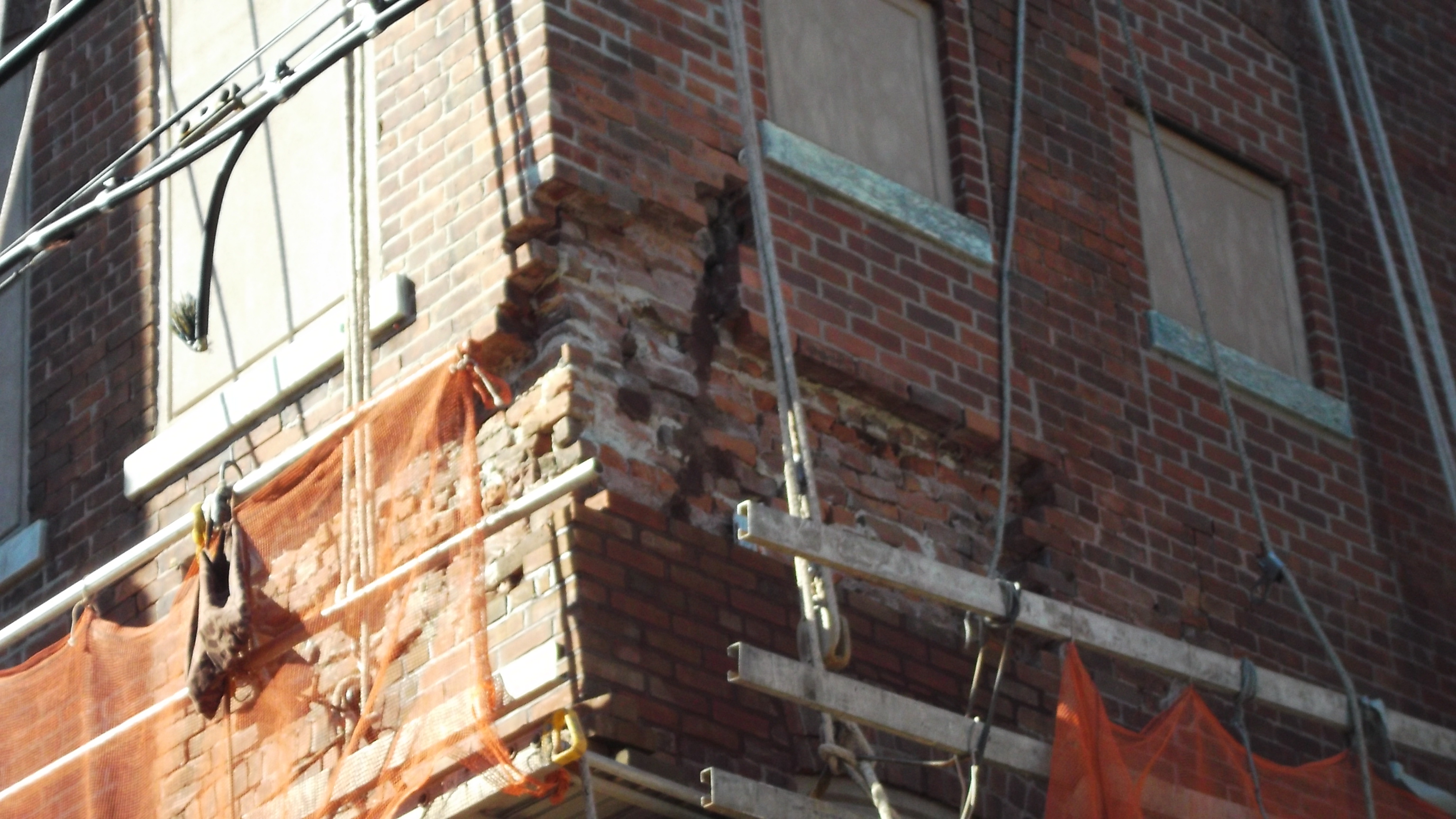 Damaged brick on Hartford Avenue side of the facility prior to restoration.
