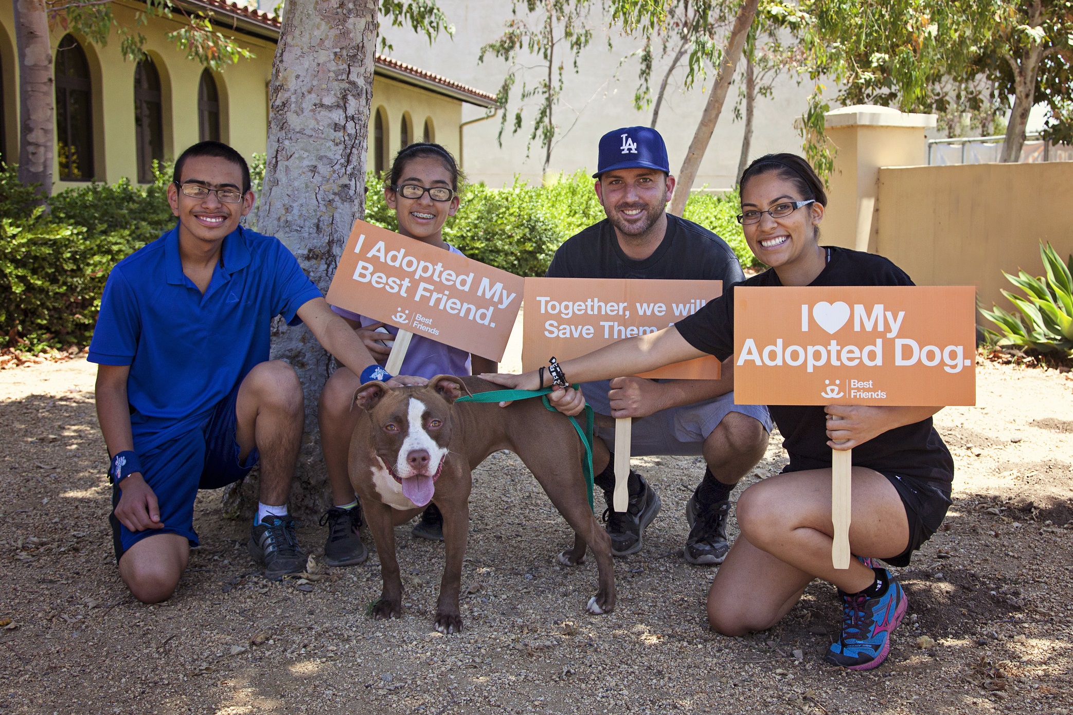 The Tovar family of Los Angeles pose with Madeline, whom they adopted in June from the Best Friends Pet Adoption & Spay/Neuter Center in Mission Hills.