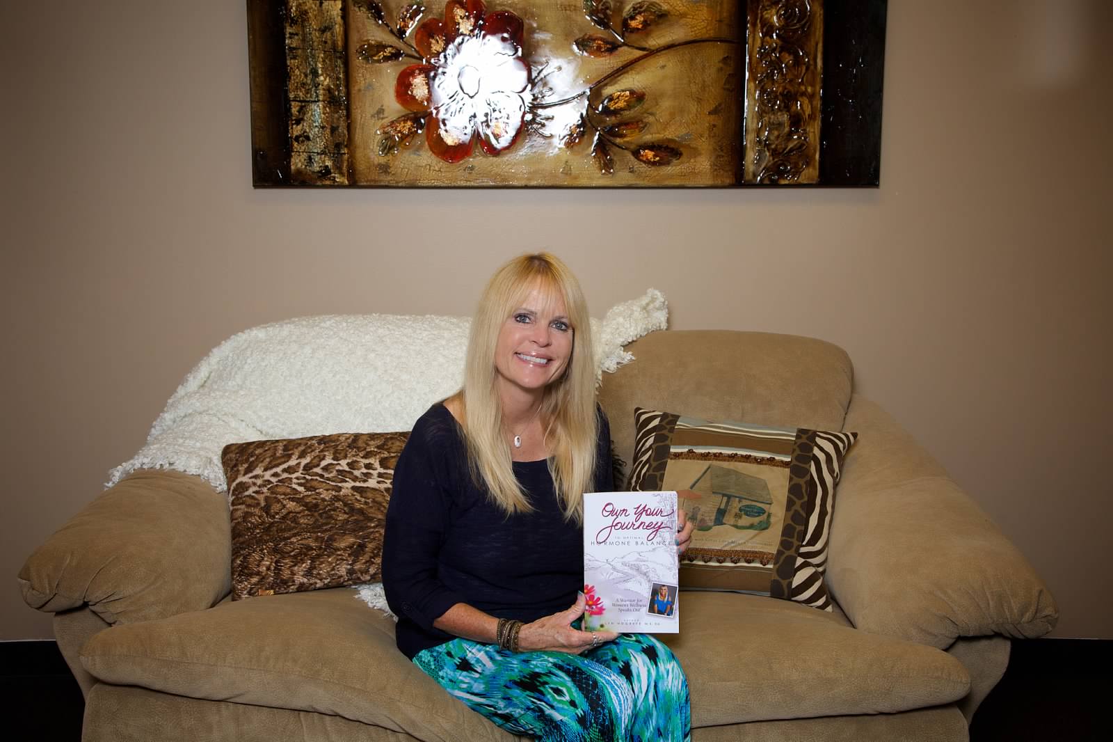 Hogrefe holds a copy of Own Your Journey to Optimal Hormone Balance. (Photo Provided)