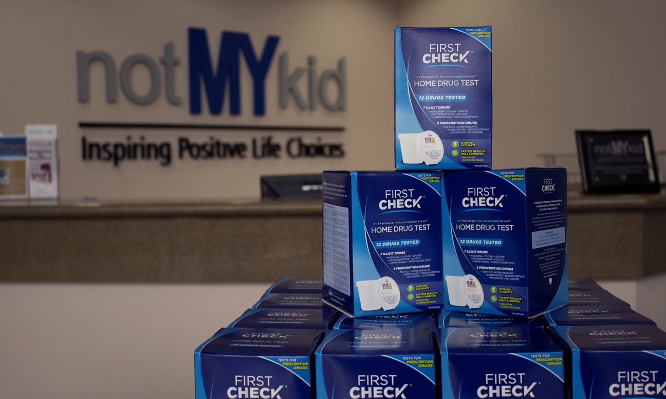 First Check Home Drug Test Kits with NotMYkid sign in the background