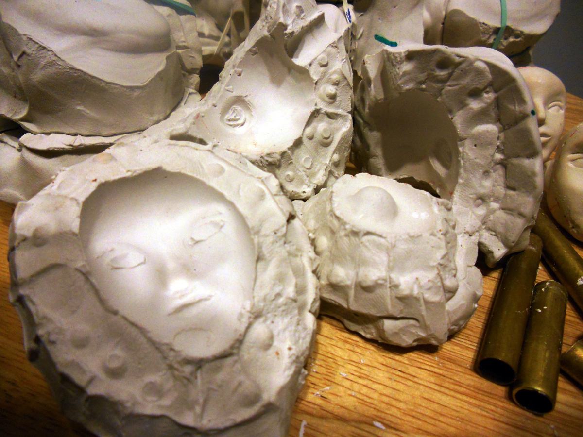 Image 5: Each head needs a mold because the faces are all different. Each head will eventually have a 4-piece mold