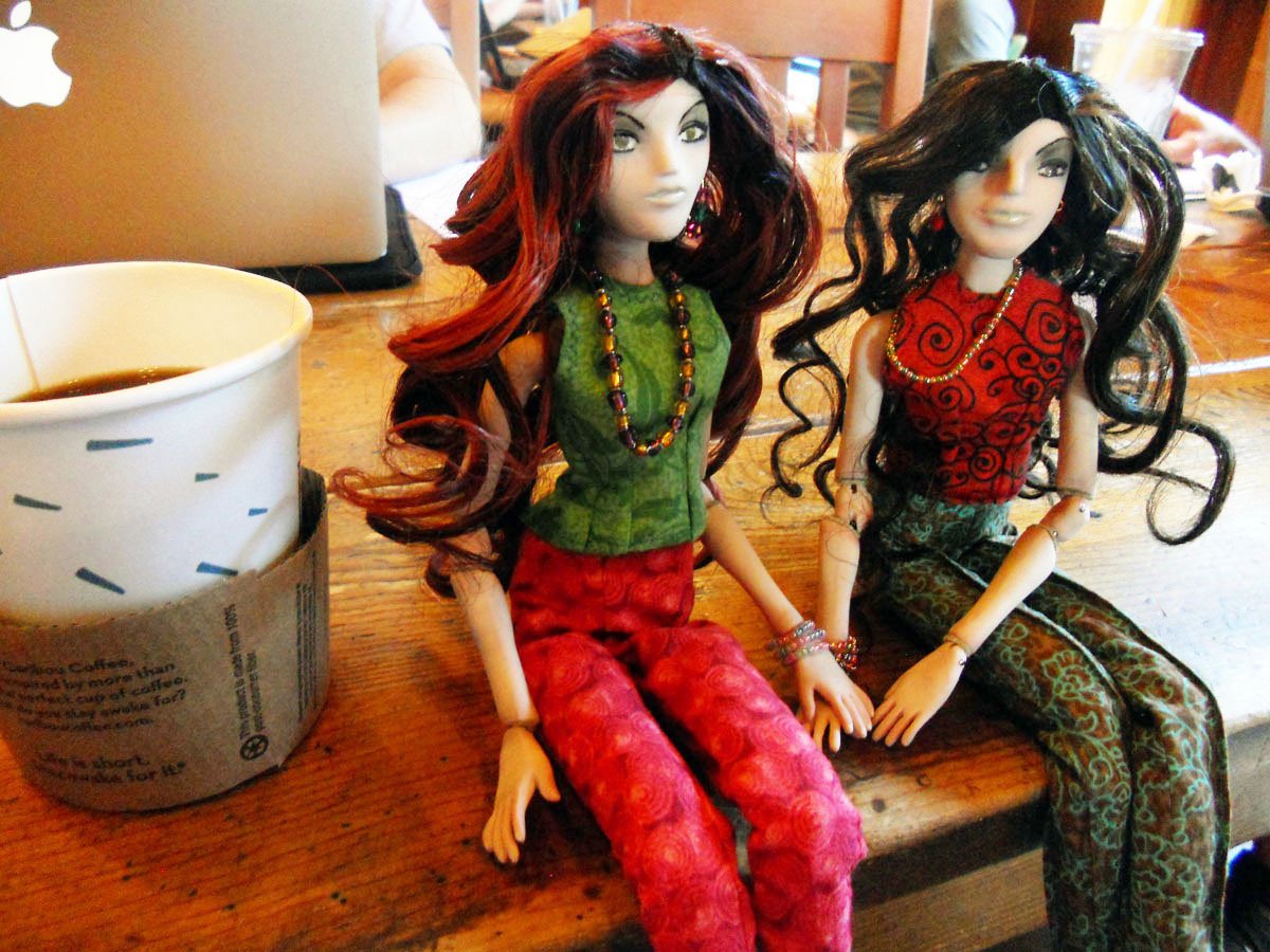 Image 18: A picture of the dolls at a cafe. After all that work, it would be nice to relax and have some coffee