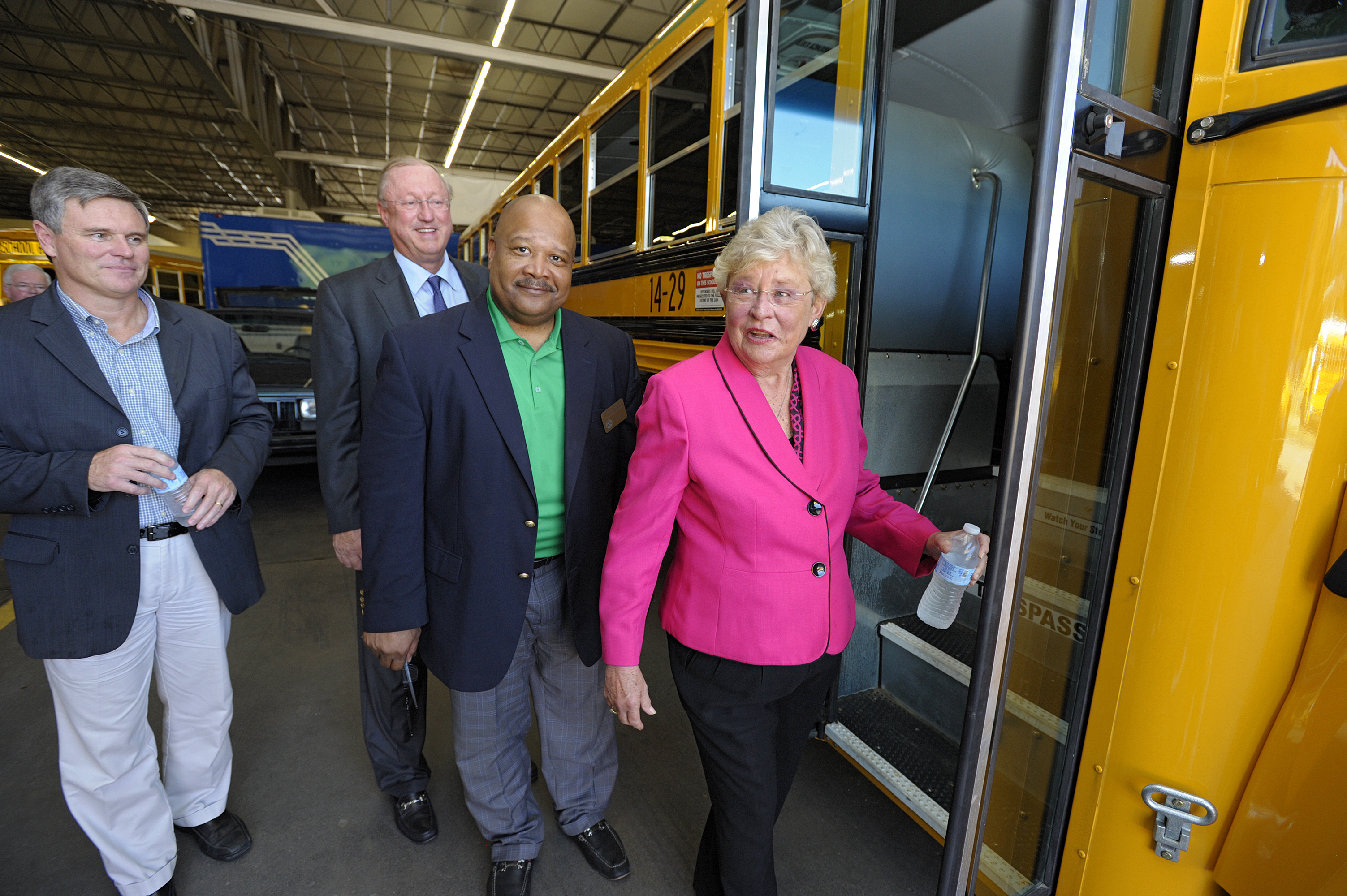 Lieutenant Governor Kay Ivey, MCPSS Transportation Director Pat Mitchell, State Senator Rusty Glover and Blue Bird Chief Commercial Officer Dale Wendell board one of Mobile County's new propane autoga
