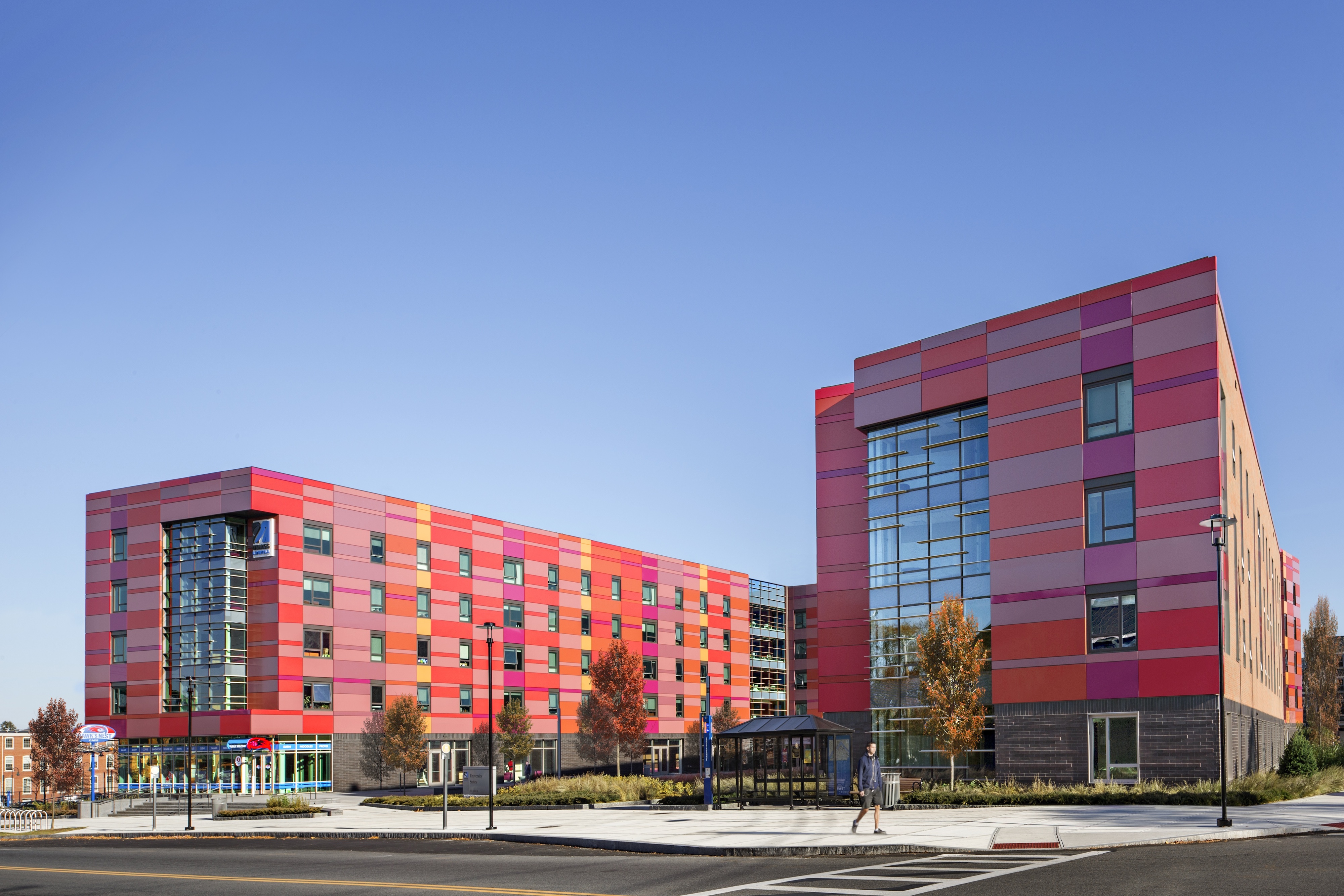 Exterior Pattern of Brick and Metal Panel and Bold Colors inspired by the early 19th Century Jacquard Loom Punch Cards