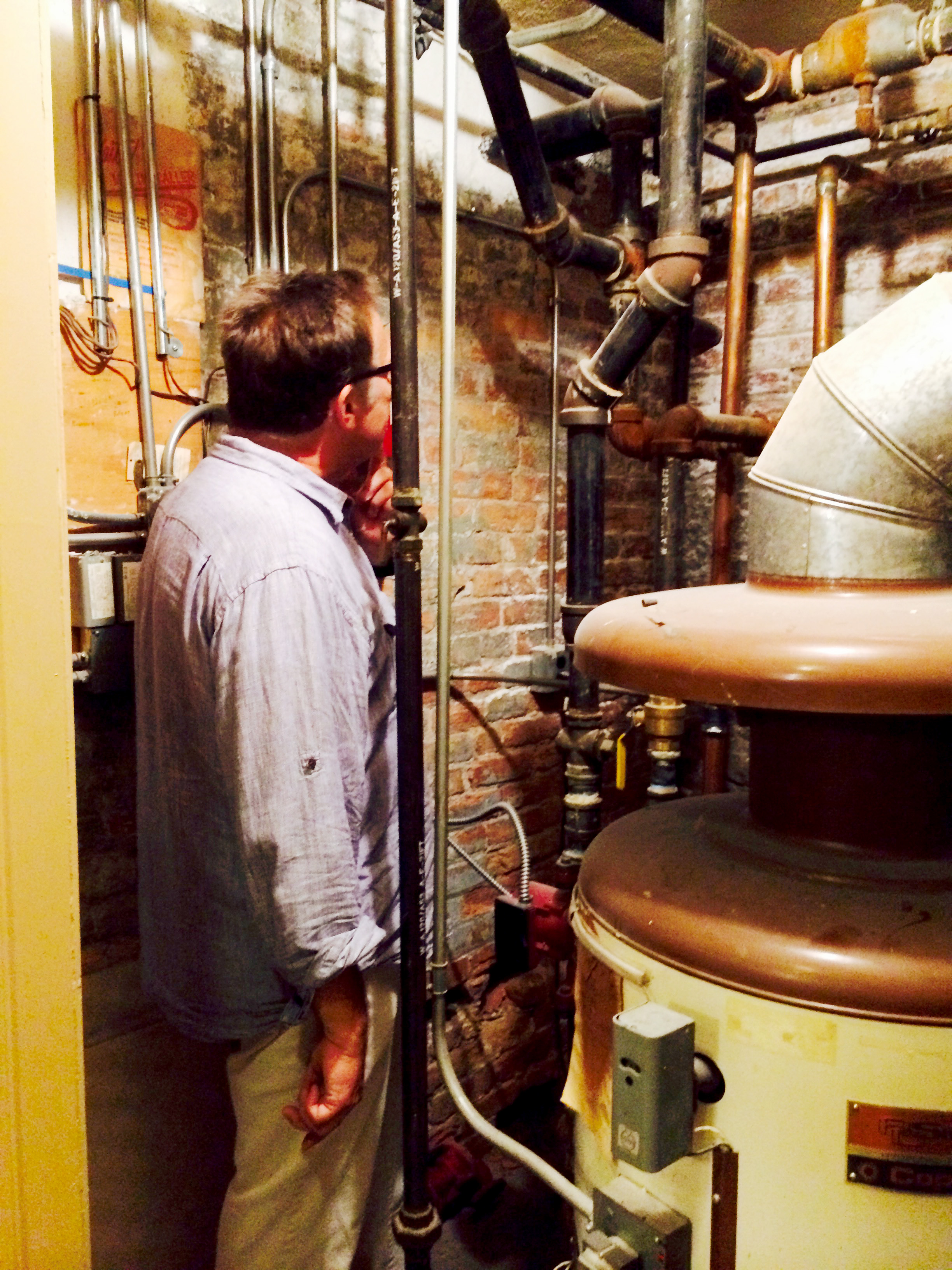 John Eifler takes a look at pipes in the basement of the house