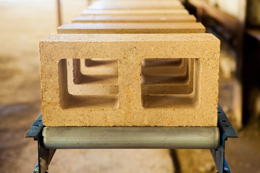 Watershed Block coming off the production line in the pilot factory in Napa, California. Watershed Block are the same size and offer the same structural characteristics of a traditional concrete block
