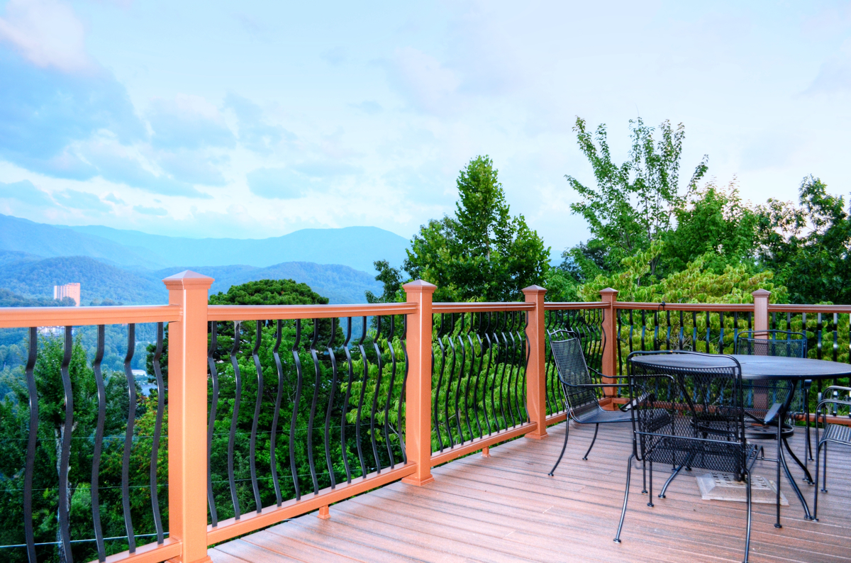 The private deck at the brand-new Condo Greystone House offers unbeatable views of downtown Gatlinburg