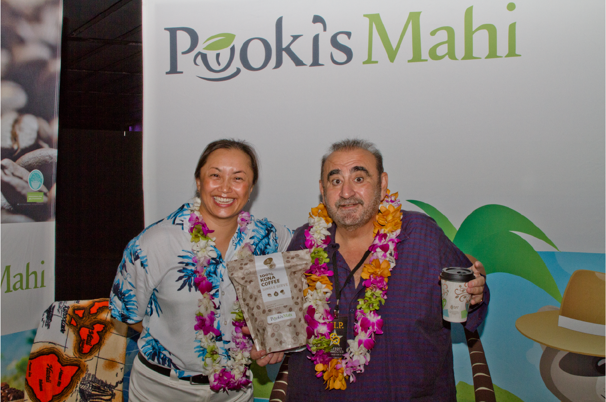 Actor/Producer, Ken Davitian congratulating Pooki's Mahi's Founder/CEO Les Magsalay-Zeller on a successful premier (100% Kona coffees Single Serves).