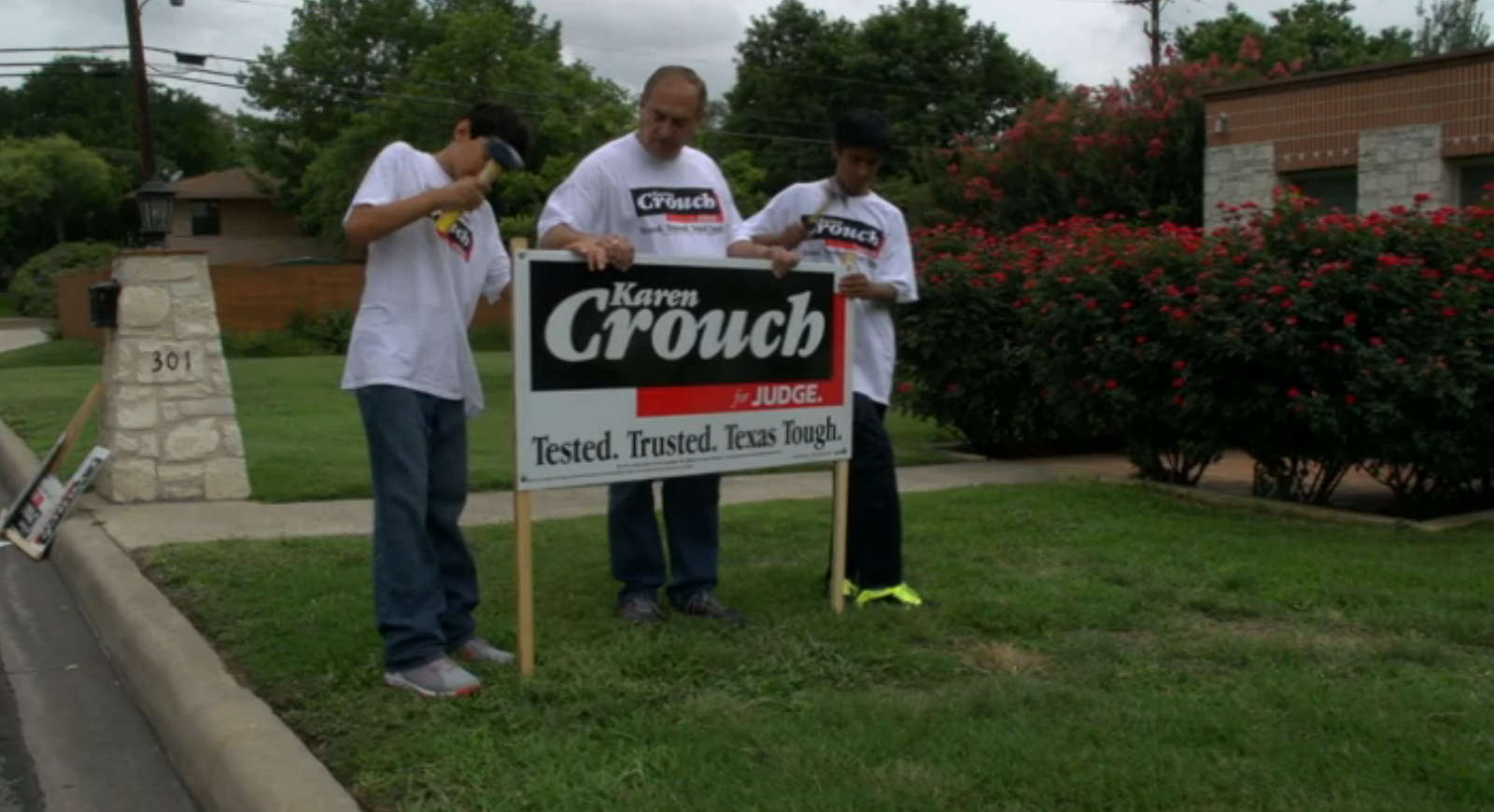 Sons Nicholas and Gerald with their father Gerald Flores are the sign crew for team Crouch.