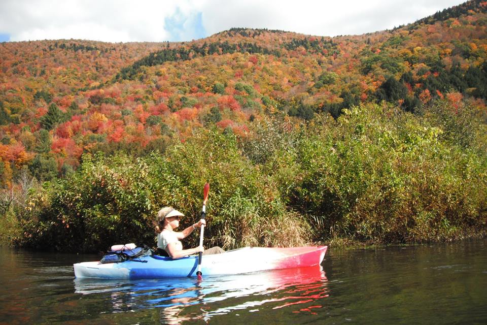 kayaking a local flat water river during foliage