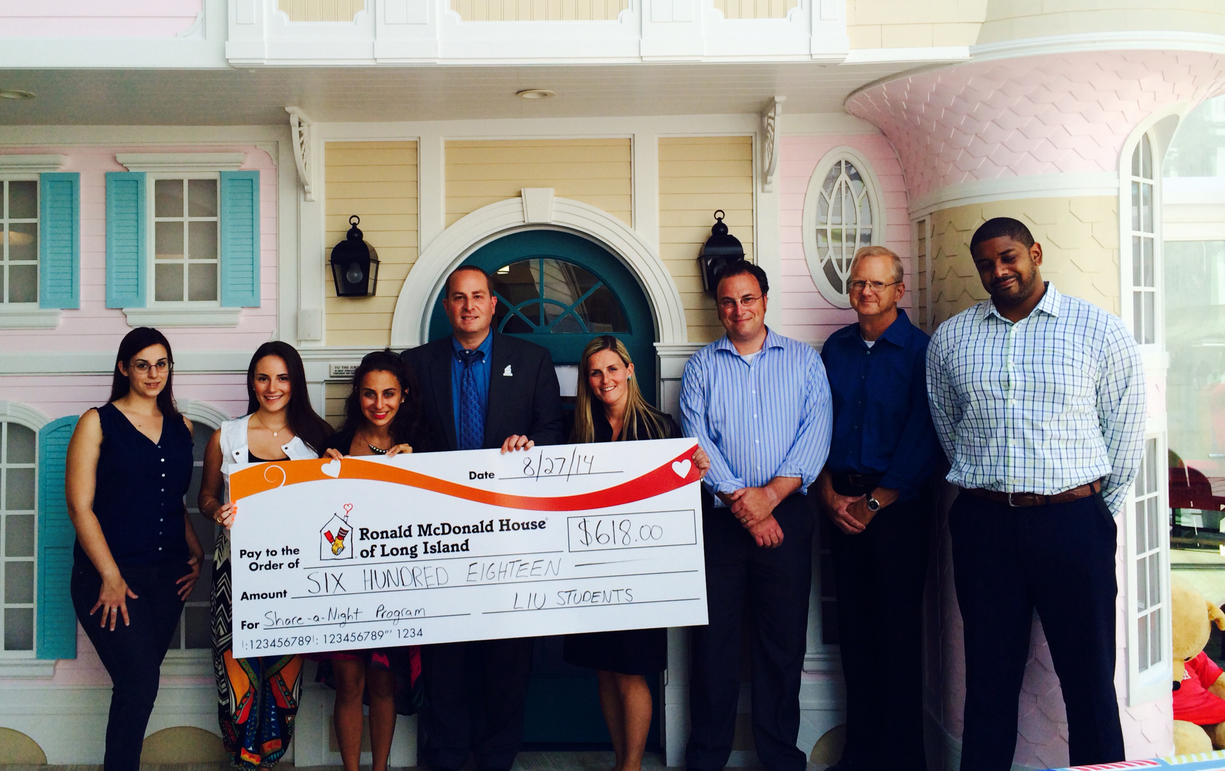 LIU Professor Jalajas, his students and Crowdster present the check to Ronald McDonald's House of Long Island