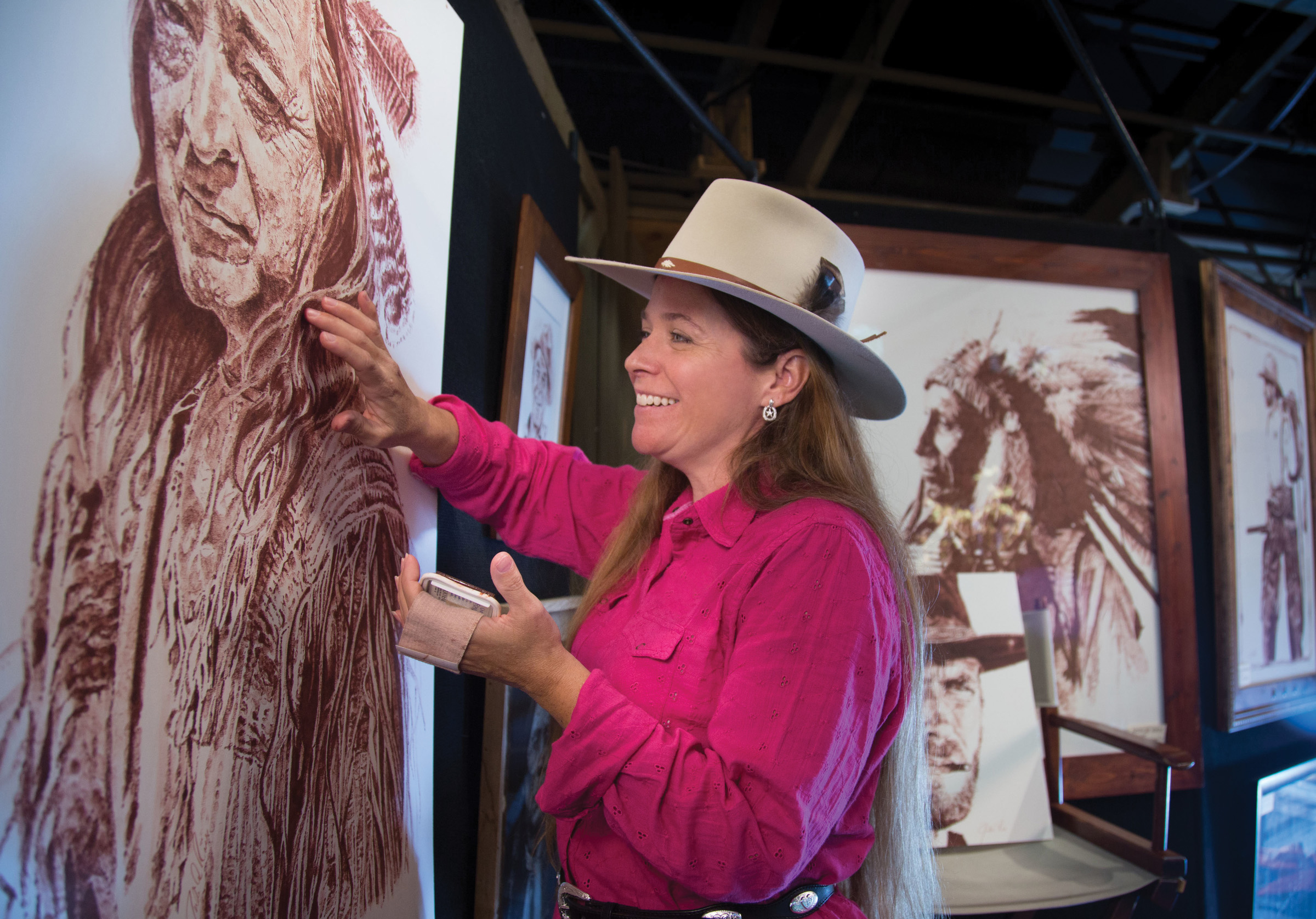 Western touch painting is one of the crafts demonstrated during the National Harvest and Cowboy Festival, featuring 125 visiting artists joining the park's 100 resident craftsmen.