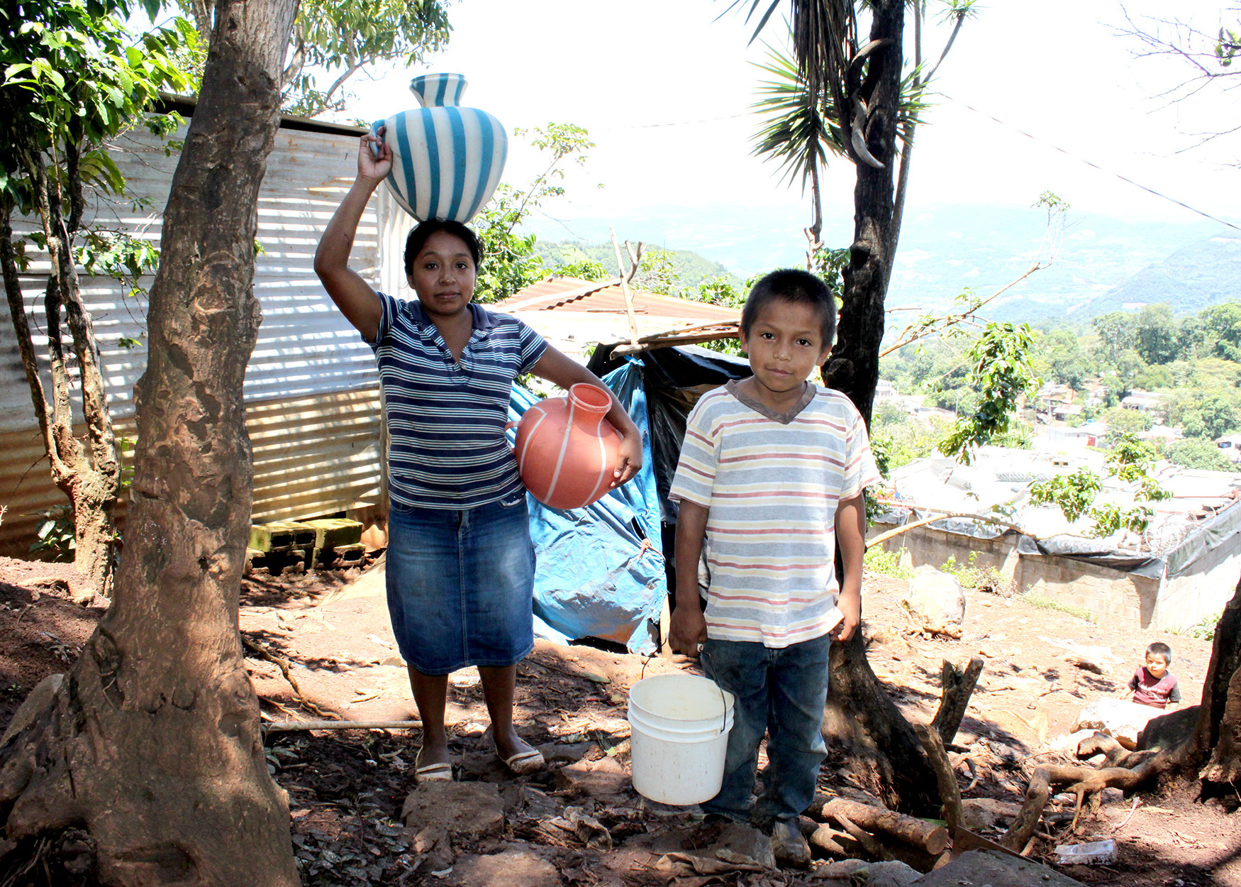 Edelrmira and Josue walk to get water in Guatemala.