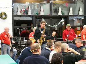 Tim McLoone and members of Holiday Express performing at Eva's Village.