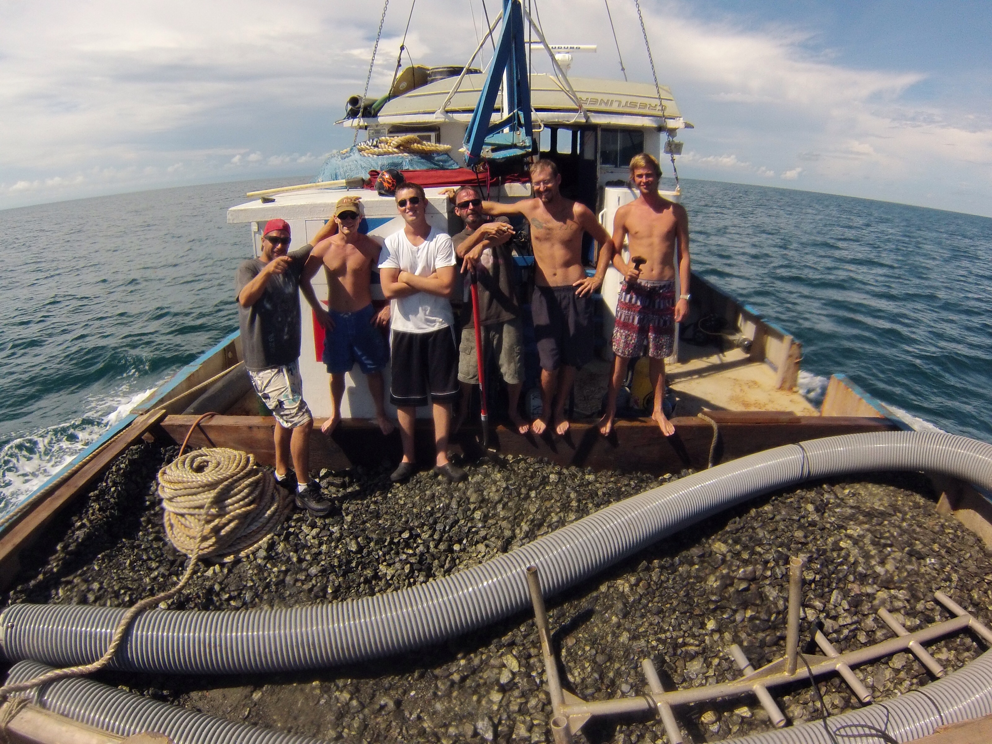 The crew on the deck of the RV Aqua Quest with a load of valuable copper ore - Photo by Aqua Quest Films