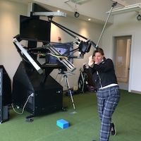 Lori Heller taking a Lesson on the RoboGolfPro