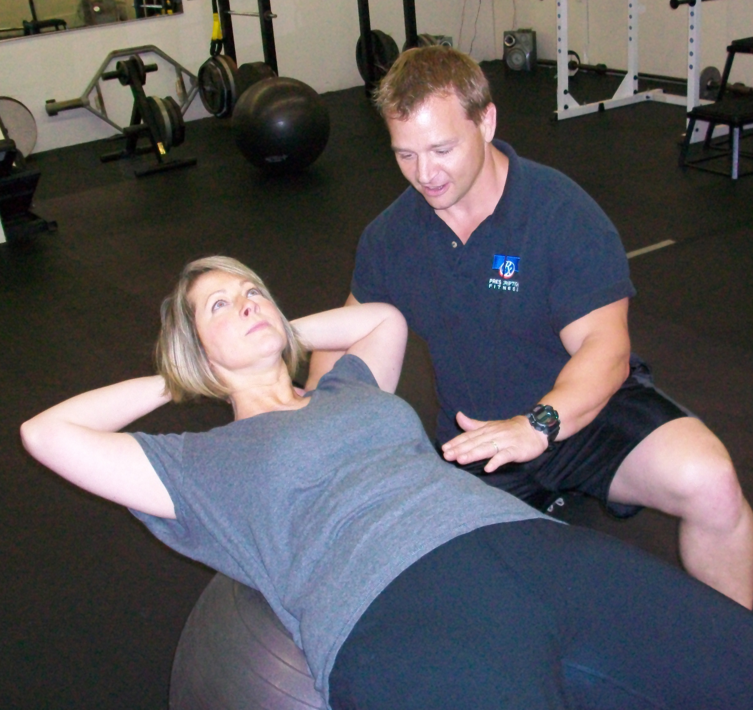 Prescription Fitness owner Joe Butler works with a client.