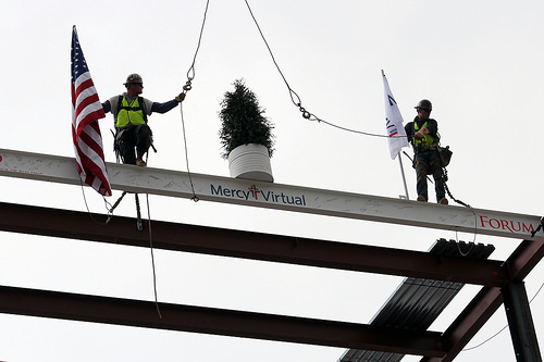 The final beam of the world's first virtual care center is hoisted into place.