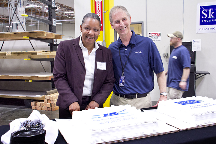 On April 30, 2014, Demetria “Lynn” Strickland and Skills Inc. CEO, Todd Dunnington celebrate launch of AJAC's Precision Metal Fabrication Apprenticeship Class at Skills Inc. in Auburn, WA.