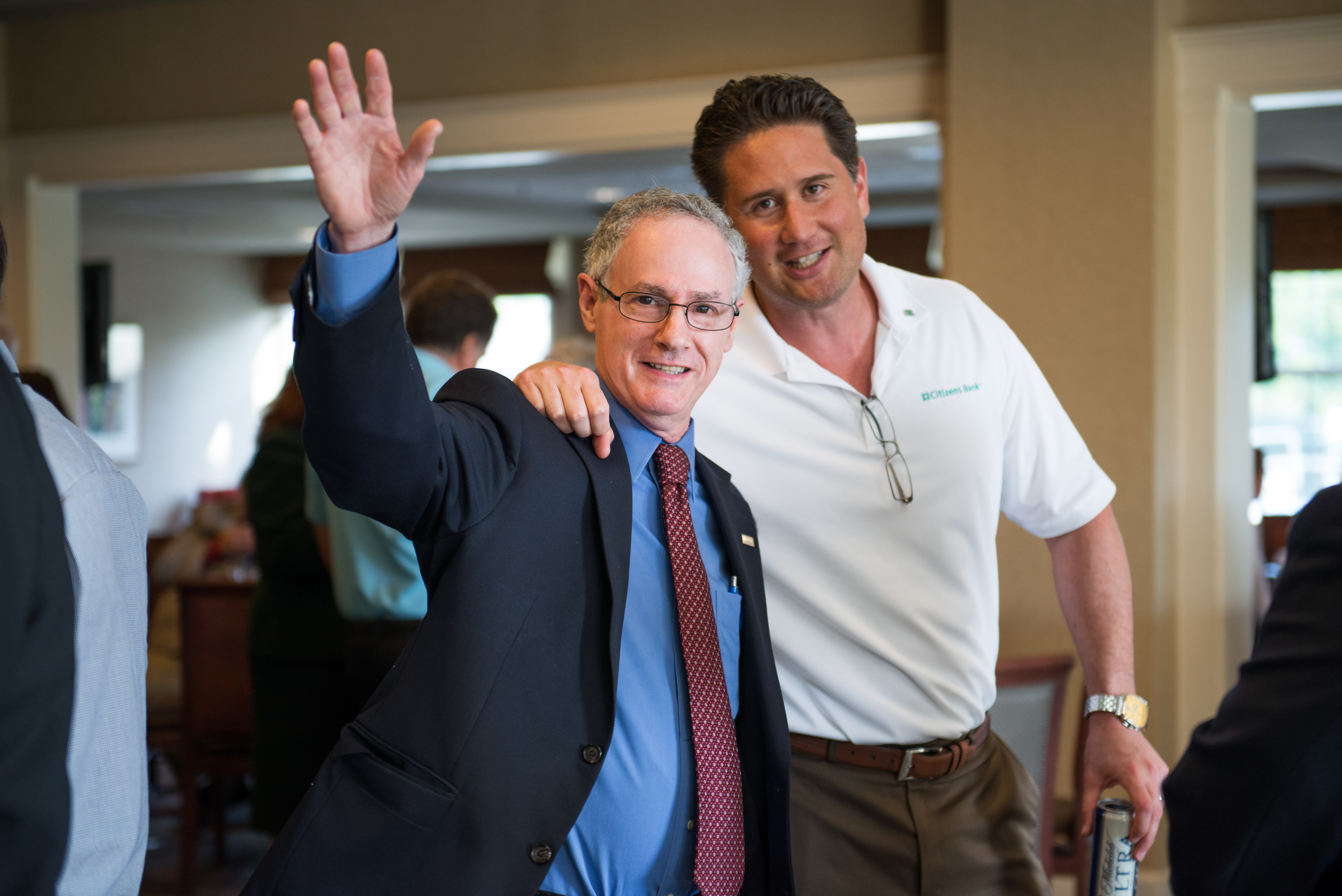 Marc Kiner greets a Premier supporter with event sponsor Brandon Wheatley of Charter One Bank. (Cappa Brown Photography)