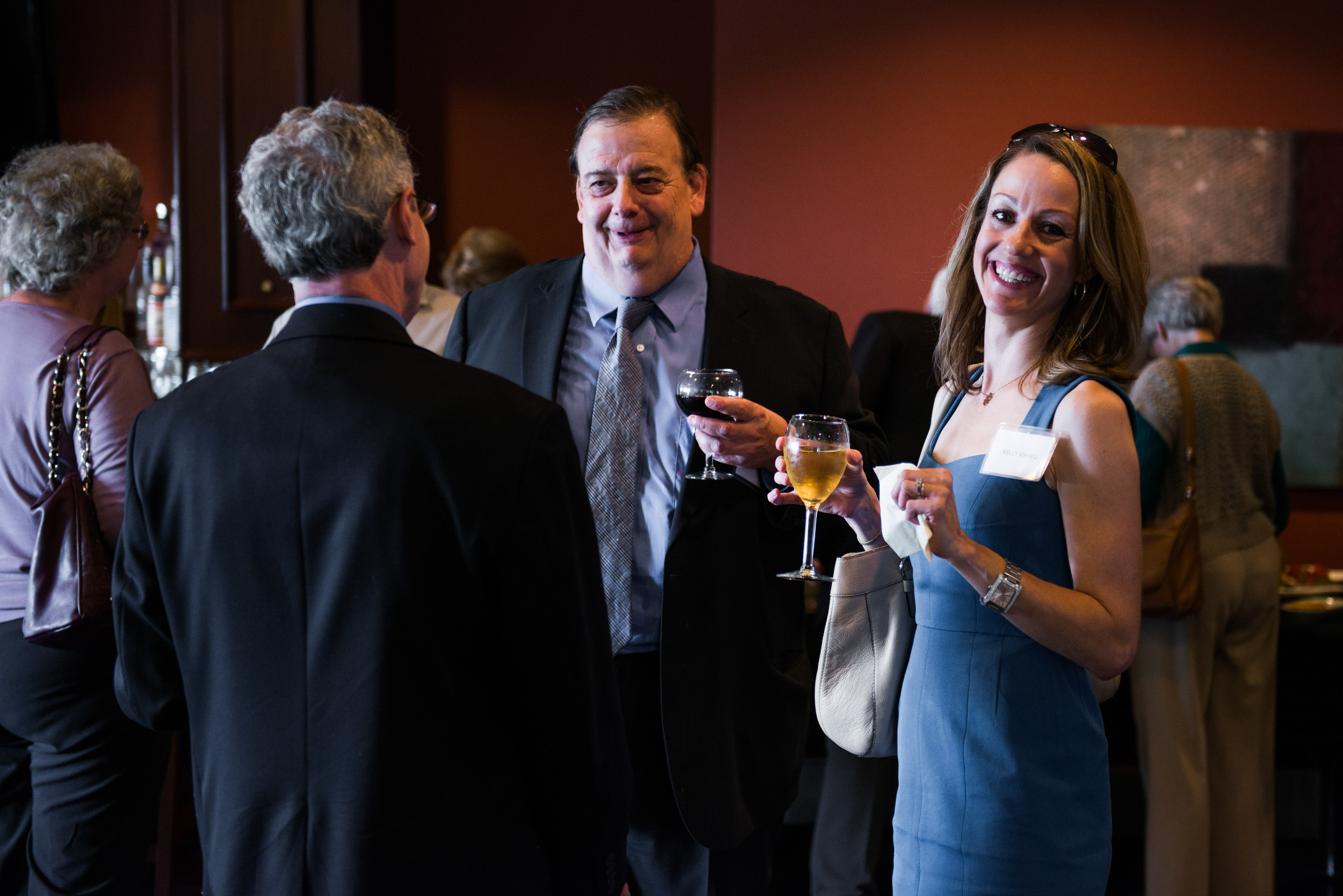 Kelly Maheu of the National Underwriter Company in Erlanger, Ky., enjoys a glass of wine at the Premier Social Security Consulting appreciation event.