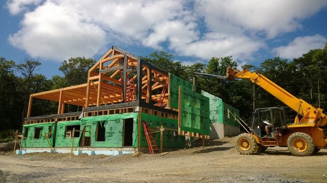 After raising the frame for this Austerlitz, NY family home, the NEW timber framers headed home, handing the reins over to the NEW construction group for enclosure.
