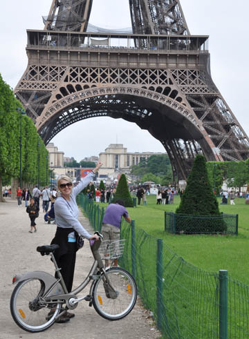 Left Bank Writers Retreat founder Darla Worden visiting the Eiffel Tower on one of her June in Paris writing workshops.