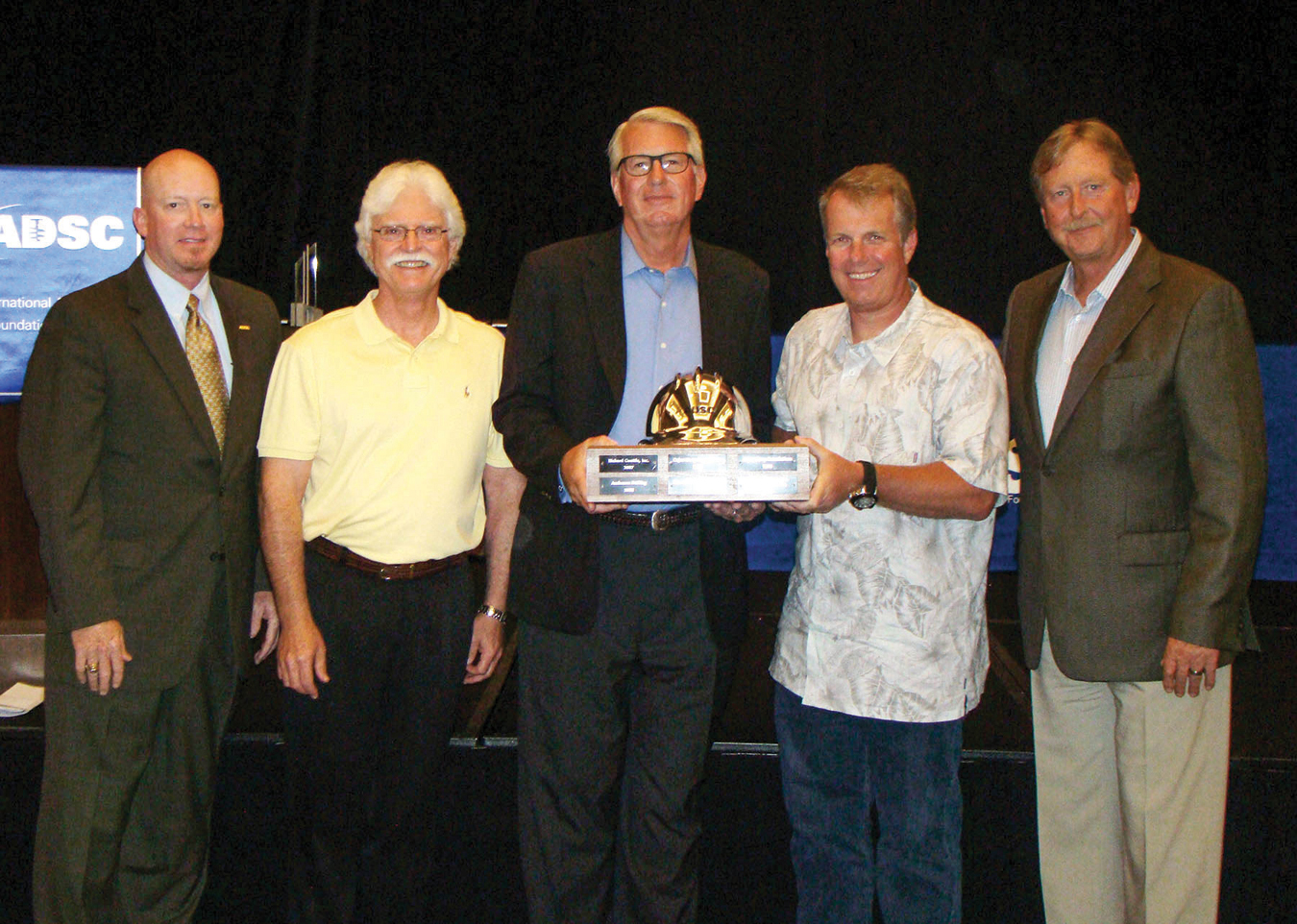 Rick Walsh and Steve Scherer accept the Rick Marshall Commitment to Excellence in Safety Award for Hayward Baker during the annual ADSC Awards Luncheon in July 2014.