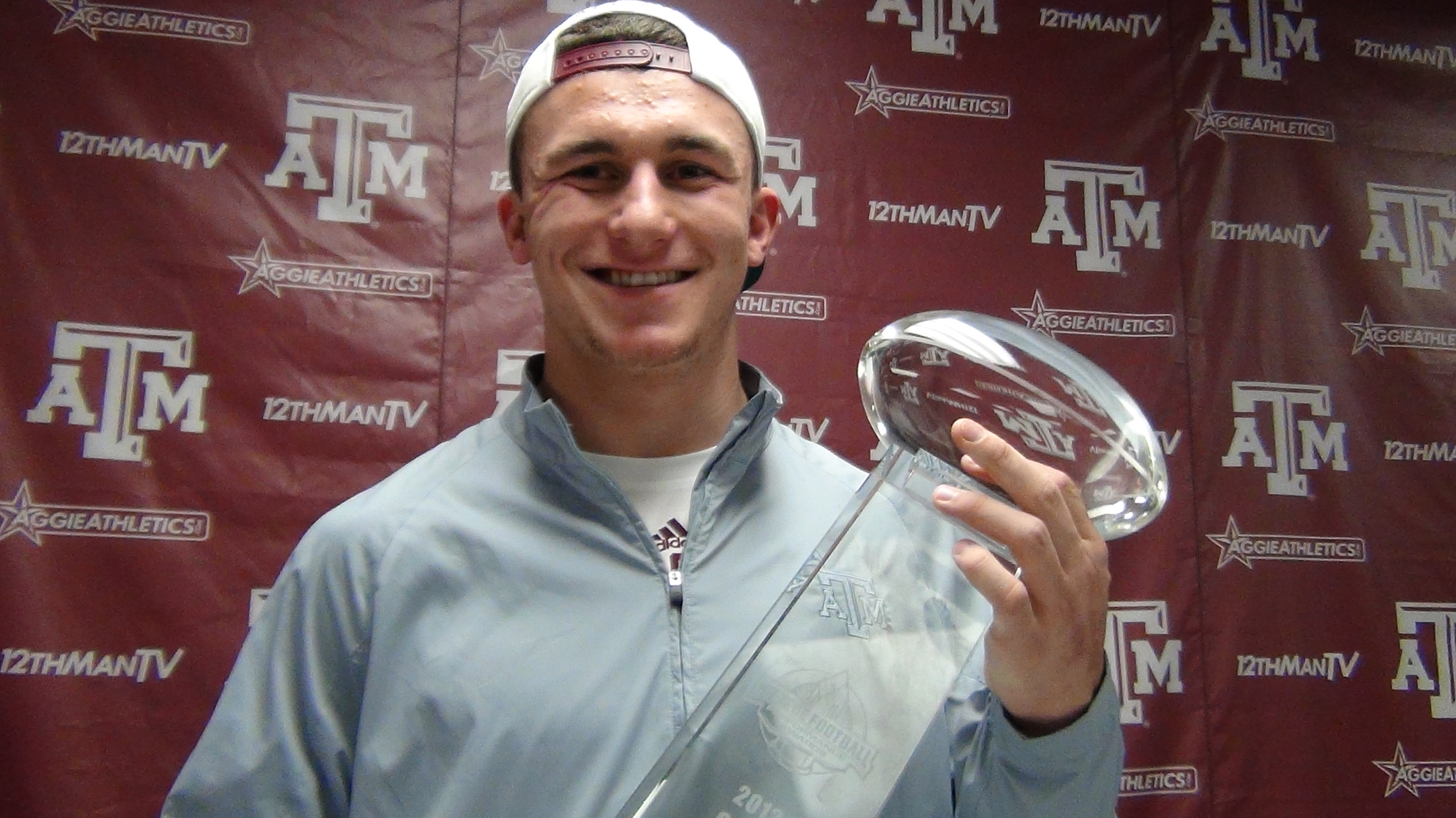 Johnny Manziel with the CFPA Trophy