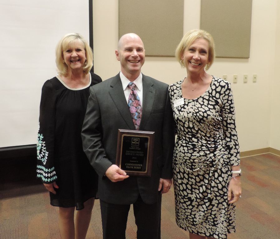 Easter Seals Southern Georgia's Executive Director Beth English and Board of Directors outgoing president Kim Colby presented Frank Berry with the Distinguished Service award.