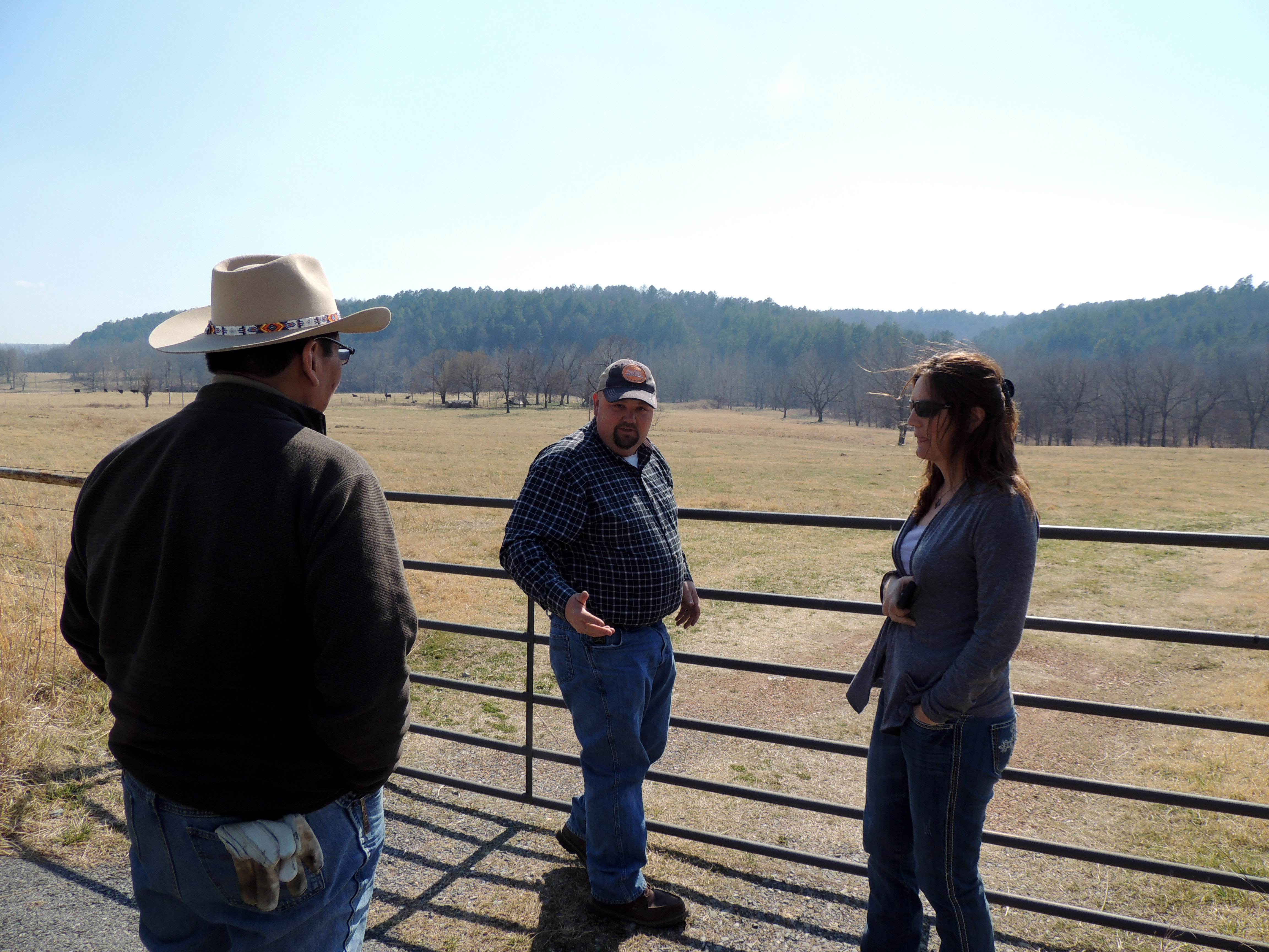 Cherokee Nation grant writer Warren Hawk, natural resources staff Trent Holland and Intertribal Buffalo Council Technical Services Provider Trudy Ecoffey look at tribal property in Delaware County in March as a site for the tribe to raise bison.