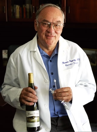 Thomas J. Fogarty, MD, with a bottle of Fogarty wine