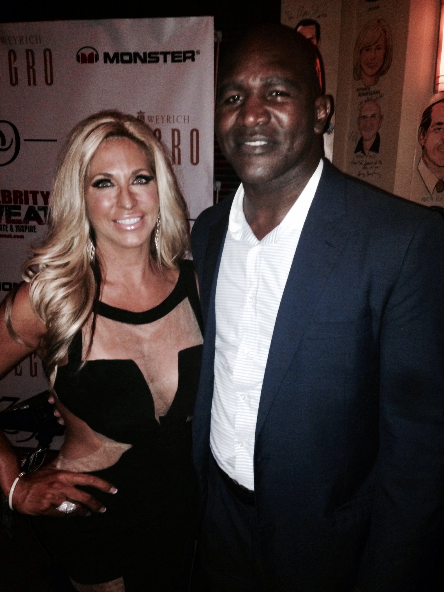 Carla Gonzalez with Host Evander Holyfield, four-time World Heavyweight Champion at the ESPY’S After Party presented by Celebrity Sweat VIP Bash - Supporting Breast Cancer Awareness