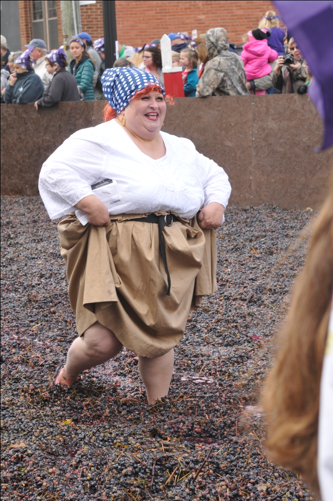 Mary Sobecki of Ohio enjoys her moment as Lucy stomping Grapes as they break the Guiness World Record for Grape Stomping Oct. 11, 2014