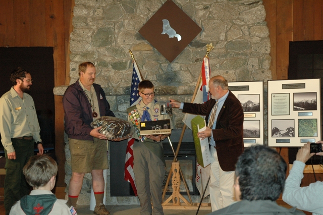 Camp Parsons Wilderness 50 Photo Contest 1st place winner Eagle Scout Austin Ulfers of Bellevue Troop 438 is presented with his prizes