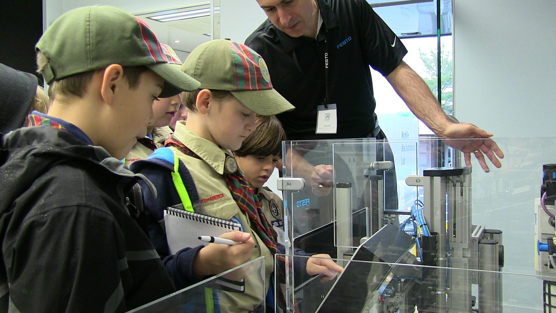 Boy Scouts learning about Machine Safety during an interactive demonstration.