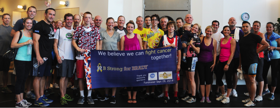 Fundraiser for Brady Wein held at Flywheel, banner held by Mitch Flippo (right) and Kyle Martinez (left)